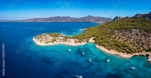 The beautiful coast of Moni island, next to Aigina in the Saronic Gulf of Athens with turqoise sea and lush, green hills