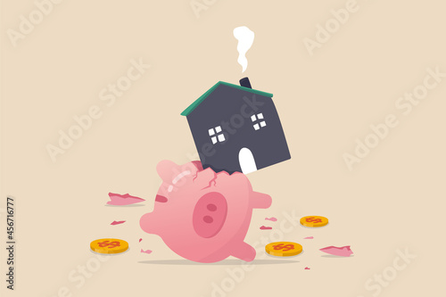 House expense and cost, too expensive payment or high interest rate mortgage concept, heavy house broke savings piggybank metaphor of too much payment and cost.