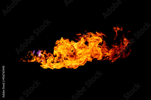 Flames caused by the explosion of the oil isolated on black background. Demonstration of water on oil fire.