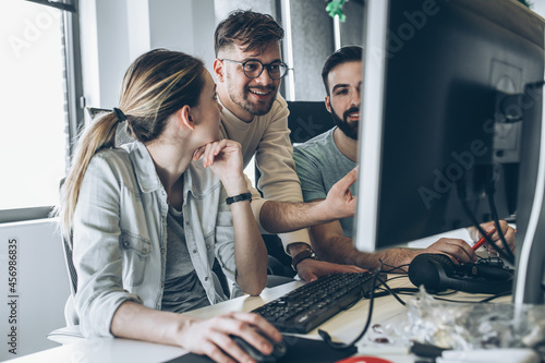 Group of programmers and software developers working on a new project at the office. 