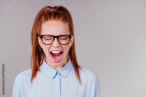 redhair ginger woman feeling angry and irritation studio background