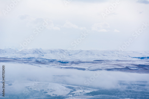 Kislovodsk, Russia. December 28, 2018. Majestic mountain peaks in the fog.