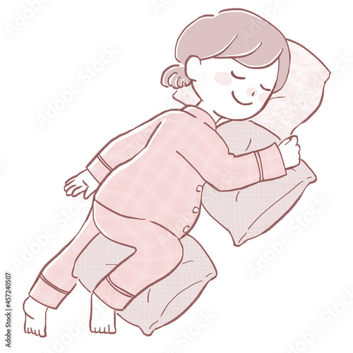 シムスの体位で横になって眠る妊娠中の女性