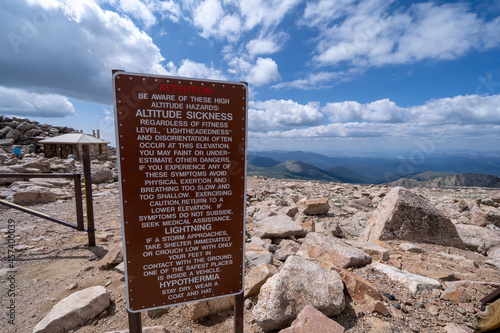 Dire warning sign of lightning strikes and altitude sickness at the summit of Mt. Evans Scenic Byway in Colorado