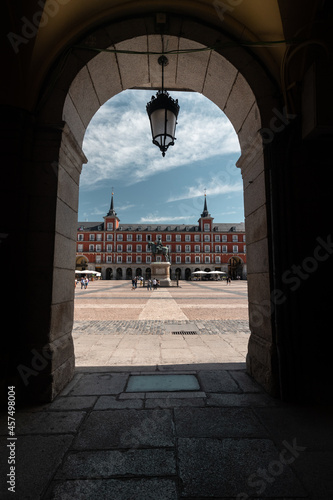 Vertical shot through an old-style arch in Plaza Mayor in Madrid, Spain