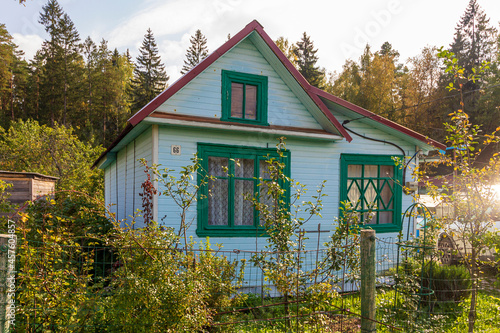 Typical architecture dacha. seasonal, year-round second home in exurbs. Village summer houses in forest. Poor Soviet housing. Electricity supply, electric wire.