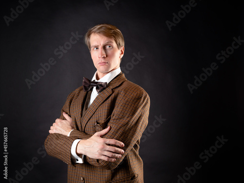 A young, solid man in the image of a Victorian scientist,