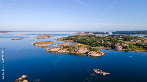 Swedish archipelago in Bohuslän with a blue sky in the background - Drone Perspective Landscape Photography