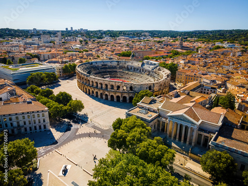 The aerial view of Arena of Nîmes, an old Roman city in the Occitanie region of southern France