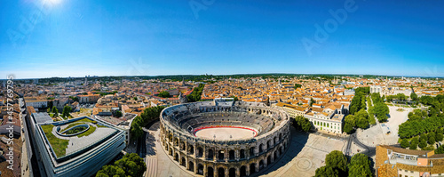 The aerial view of Arena of Nîmes, an old Roman city in the Occitanie region of southern France