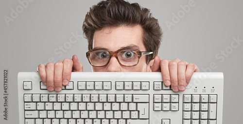 Funny geek man with keyboard