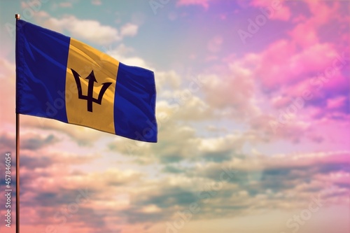 Fluttering Barbados flag mockup with the space for your content on colorful cloudy sky background.
