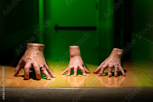 Family of Chopped Off Severed Thing Hands Walking in Hallway with Green Light and Wedding Rings Spooky Scary for Halloween