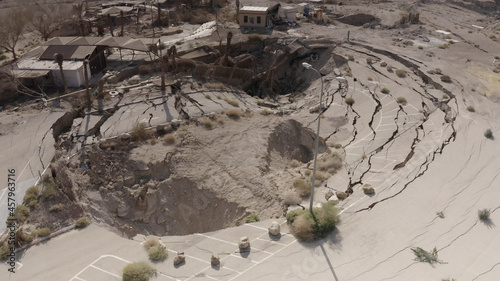 Large sinkhole close to house In the desert, Aerial view drone view from dead sea sinkhole, Israel 2021 