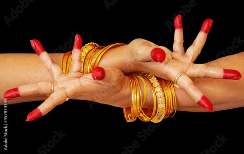 Woman dancer hands on black background showing "Avahittha hasta" meaning dissimulation as a mudra of Indian Bharatanatyam classical dance