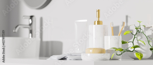 Close up bath accessories mockup with shampoo bottle basin in modern bathroom white minimalist interior