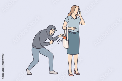 Robbery, thief and crime concept. Young man robber thief in hood trying to steal female belongings from her bag outdoors vector illustration 