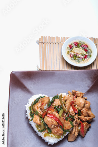 Stir fried chicken with basil over rice