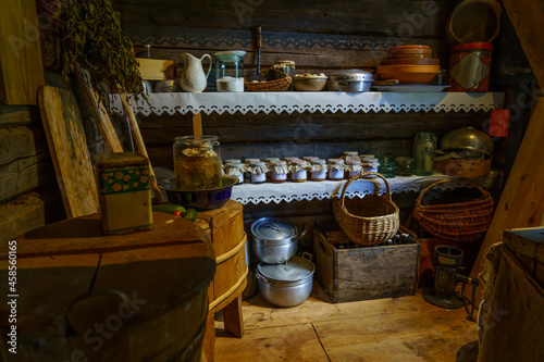 Old pantry with materials, foods and containers from long ago.