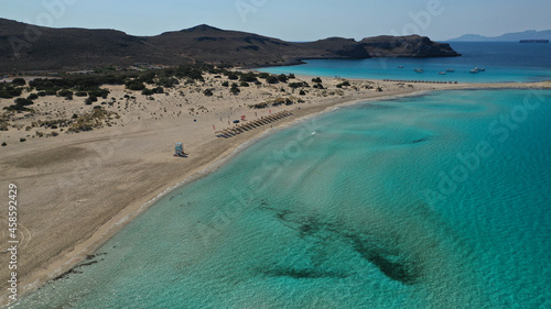 Aerial drone photo of paradise turquoise sandy beach and bay of Simos in island of Elafonisos visited by yachts and sail boats, South Peloponnese, Lakonia, Greece