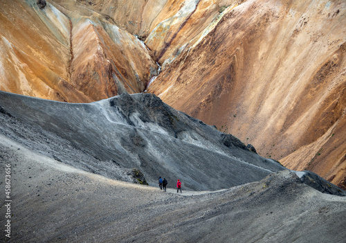 Landmannalaugar, Iceland - July 30, 2017: Hikers in volcanic mountains of Landmannalaugar in Fjallabak Nature Reserve. Iceland