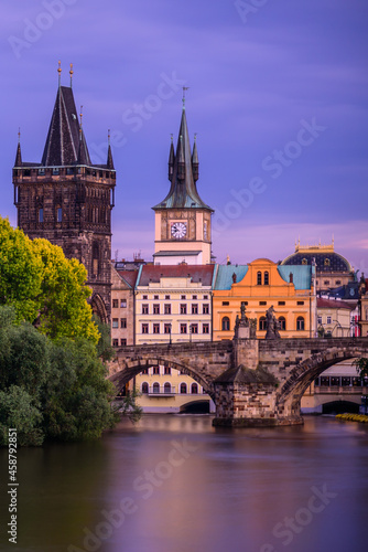 Famous Charles bridge in Prague during twilight. 