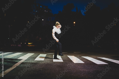 The girl with makeup of the mime. improvisation. Suit for Halloween. mime shows different emotions. Sad clown. Evening vibe.