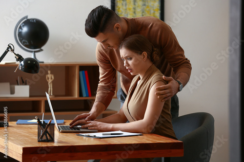 Boss harassing his secretary in office