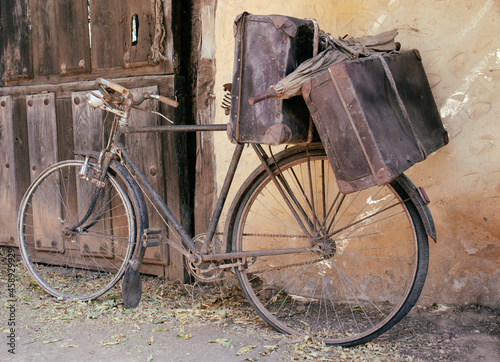 old and broken bicycle, abandoned on a facade