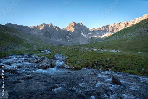 The Malaya Marka River in the Mukhinsky Gorge of the Teberda Nature Reserve with mountain peaks