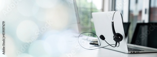 Headset and customer support equipment at call center ready for actively service . Corporate business help desk and telephone assistance concept .