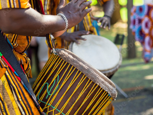 African man's hands playing the African drum. Musical culture.
