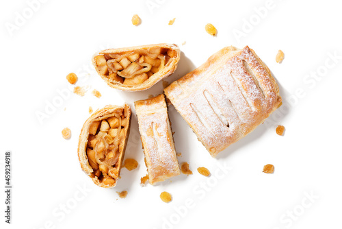 Traditional homemade apple strudel with caramelized apples and raisins. isolated on white background. top view