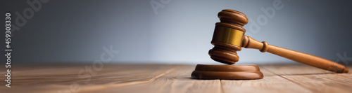 Judge gavel on wooden table.