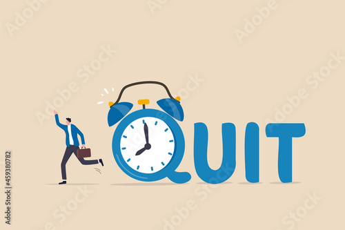 Time to quit day time job, resign from full time career, leaving company or freedom and independence from office job concept, happy businessman entrepreneur walking from alarm clock with the word QUIT