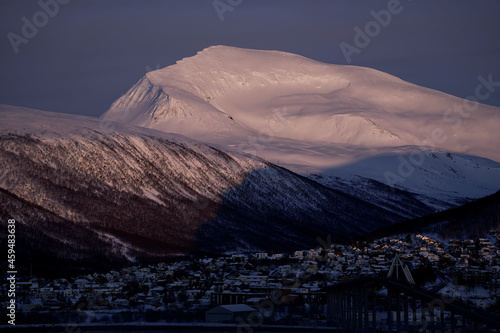 Sunset on a snowy Tromsdalstinden near Tromsø