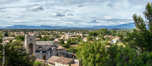 Pernes les Fontaines, small typical town of Provence and mountain range on the background, Vaucluse, France, Europe