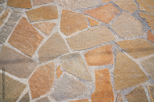 Orange old stone road surface. Seamless Texture. The texture of a stone road. High quality photo