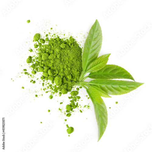 Tea matcha powder and green leaves isolated on white