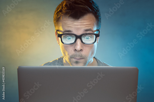 Man in front of a laptop computer