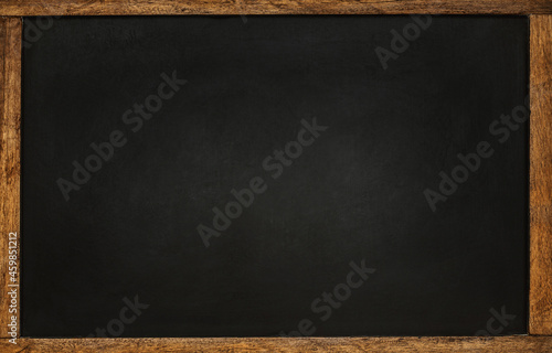 Empty black chalkboard with wooden frame. Background for school or restaurant design