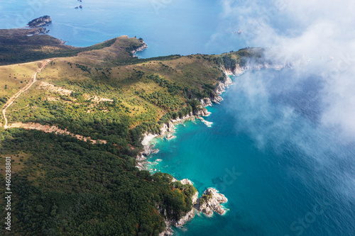 Turquoise sea and rocky coastline of autumn Gamow Peninsula, aerial view. The Peter the Great Gulf.