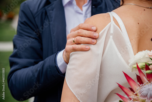 loving couple holding hands close up on blurred background