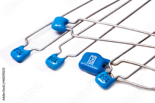 Electronic components: Group of low voltage ceramic capacitors on white background