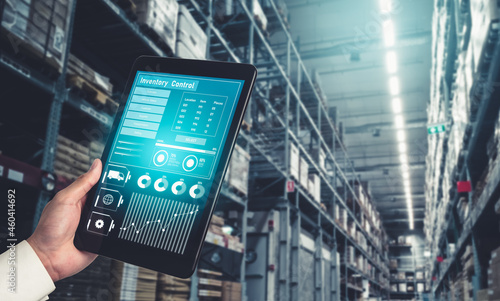 Warehouse management innovative software in computer for real time monitoring of goods package delivery . Computer screen showing smart inventory dashboard for storage and supply chain distribution .