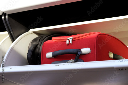 Cabin baggage in an overhead stowage compartment of an airplane