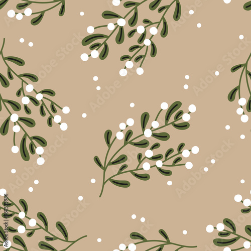 Christmas seamless pattern. Mistletoe on a beige background