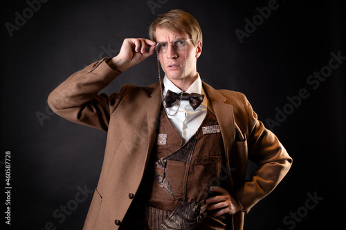 A young, solid man in the image of a Victorian scientist,