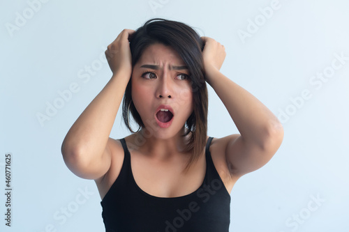 worried upset asian woman shout out loud after missing something or having a problem