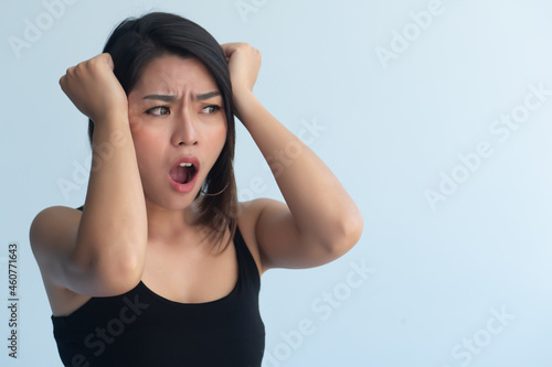 worried upset asian woman shout out loud after missing something or having a problem